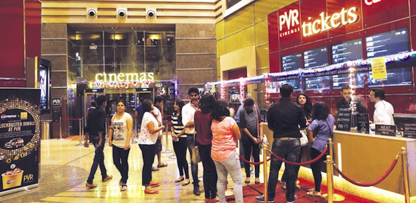 Cinema-goers wait to collect their tickets at a PVR Multiplex in Mumbai. Multiplex operators like PVR Ltd, Inox Leisure, Reliance Mediaworks and Mexican chain Cinepolis are scrambling to set up theatres targeting the rapidly growing number of middle-class Indians willing to pay to watch Bollywood movies in more comfortable surroundings.Reuters/Mumbai